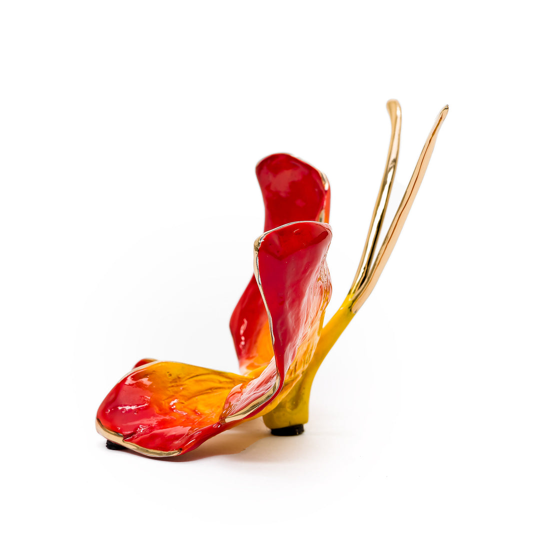 Side view of Duke Flame butterfly with molten enamel wings