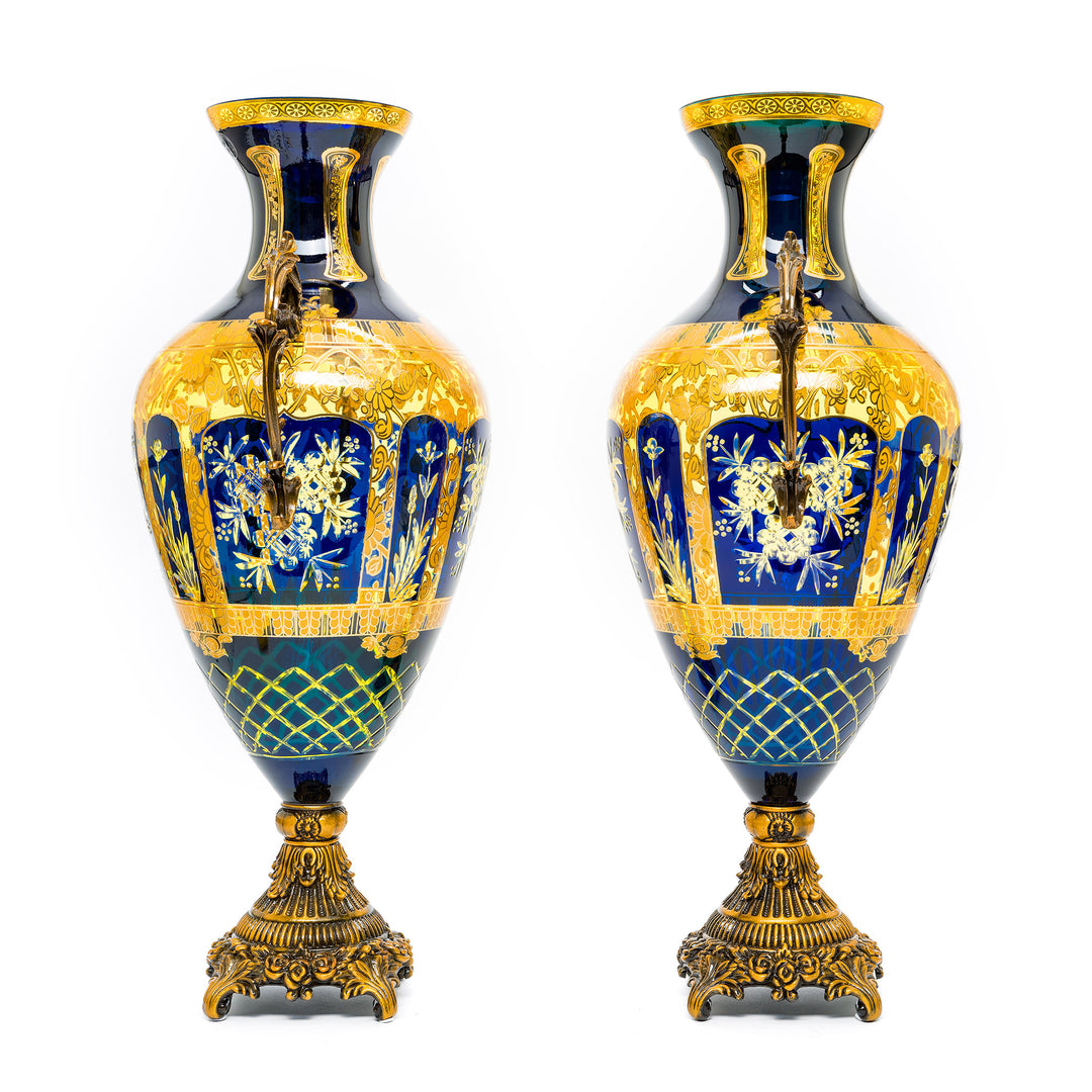 Elegant blue and gold crystal vases with bronze bases