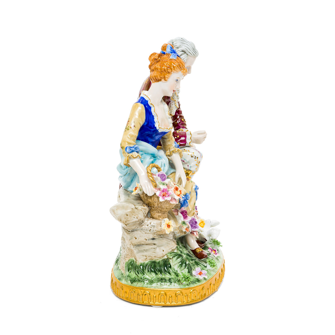 Elegant courting couple in springtime, crafted from German porcelain with intricate hand-painted details.