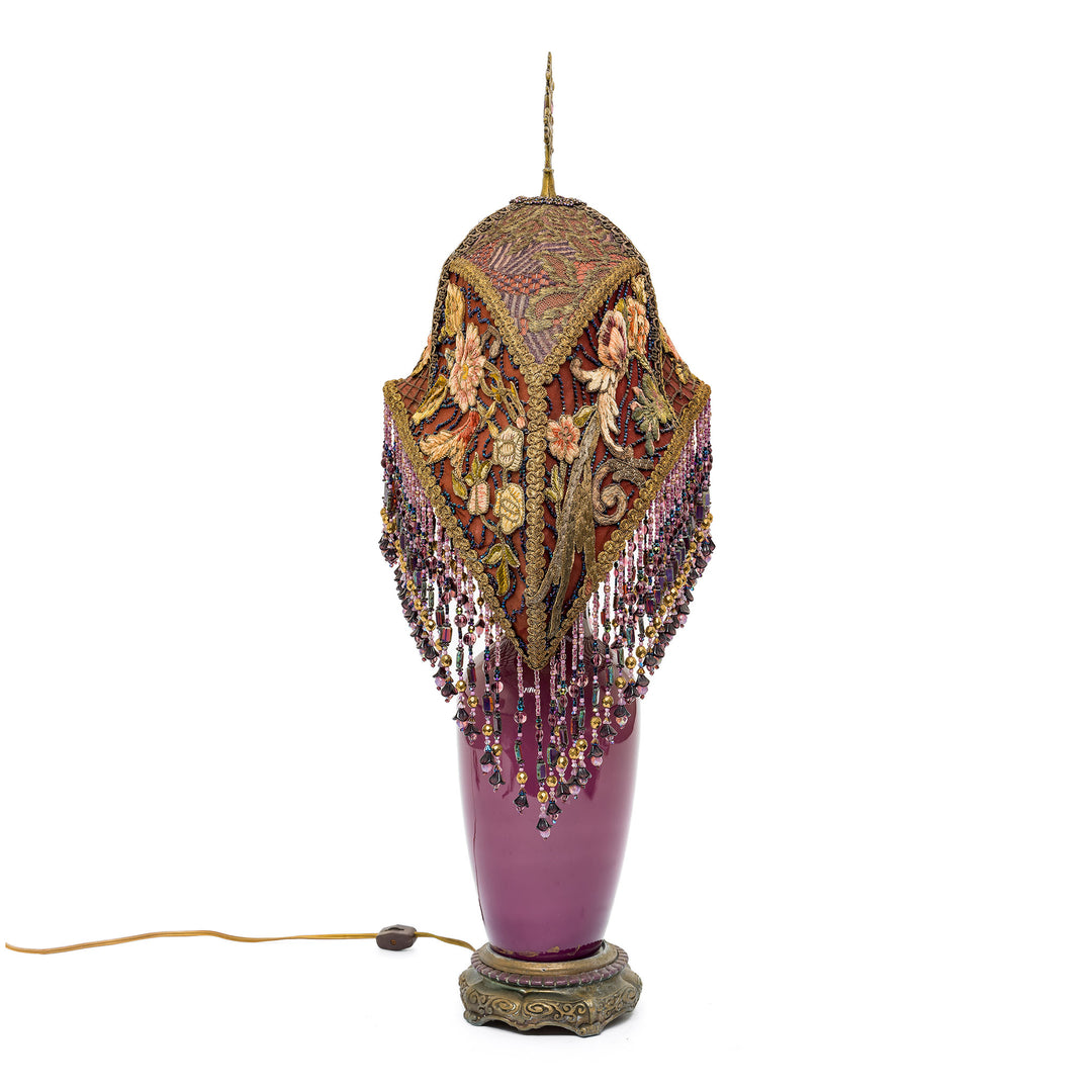 Elegant lavender glass lamp with ornate details