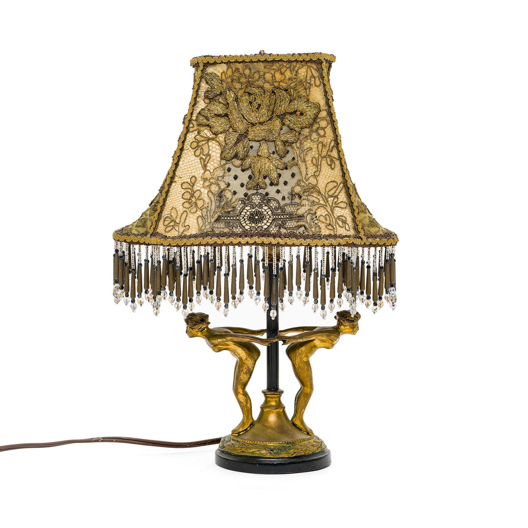 Hand-embroidered bronze lamp with antique materials