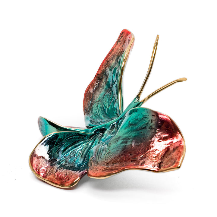 Side view of enamel butterfly with dynamic curved wings