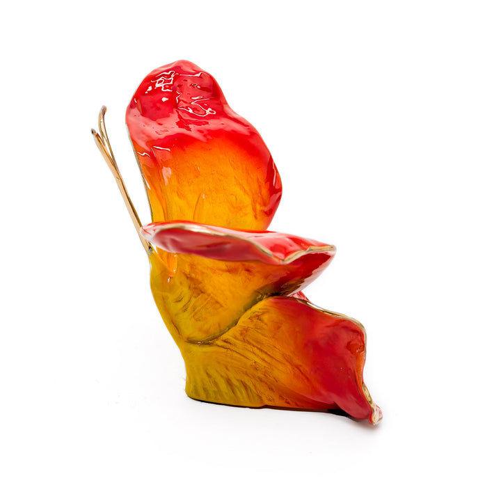 Bright flame butterfly with gold antennae and vibrant hues