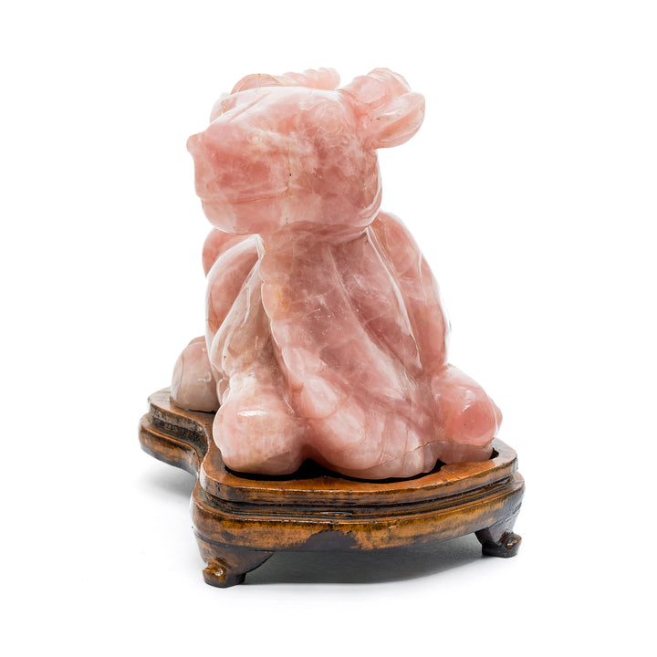 Gem-quality pink crystal buffalo on wooden base