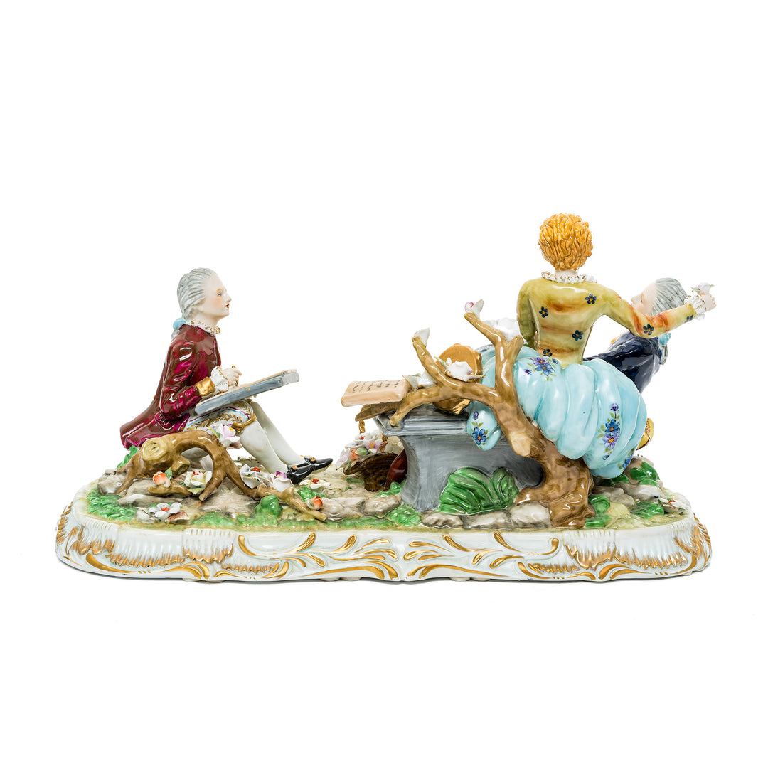 German porcelain romantic courtship figurine featuring a trio engaged in music and poetry.