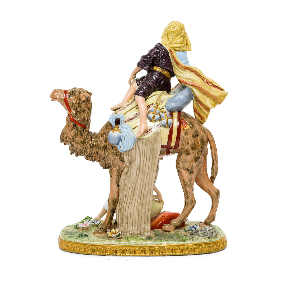 German porcelain traveler with camel figurine, showcasing vibrant colors and details.