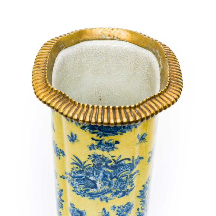 Detail of ribbed gilt metal rim on porcelain vase