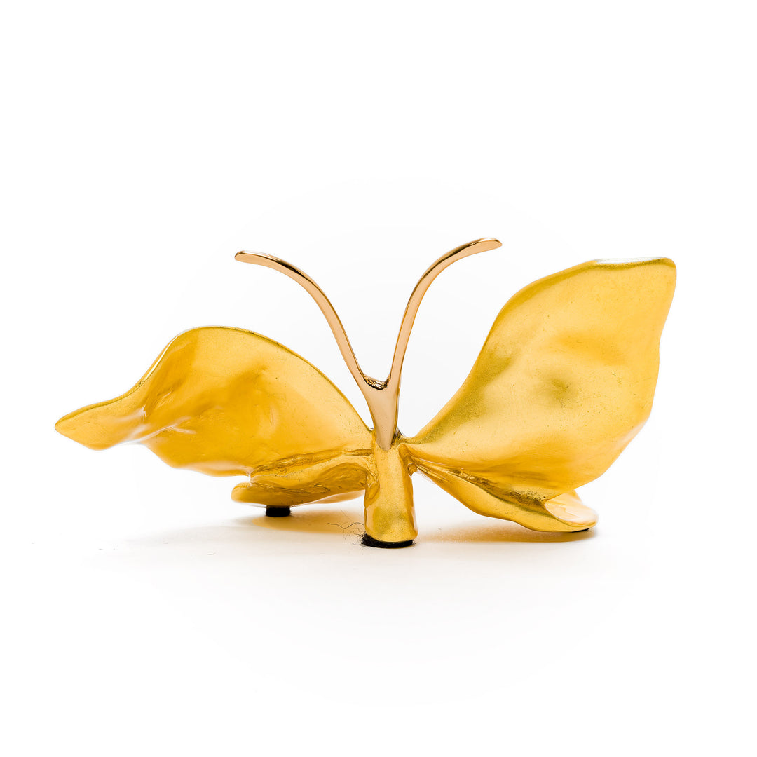 Glossy gold butterfly figurine in bronze with elegant form
