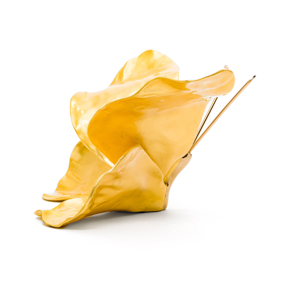Side view of gold butterfly sculpture with sculpted wings