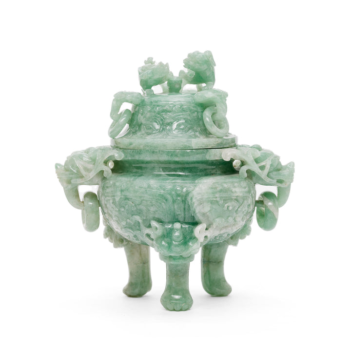 Front view of hand-carved jade incense burner with guardian figures