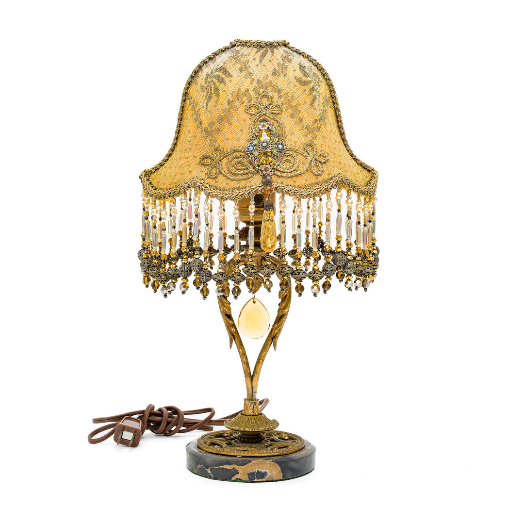 Hand-embroidered bronze lamp with antique materials