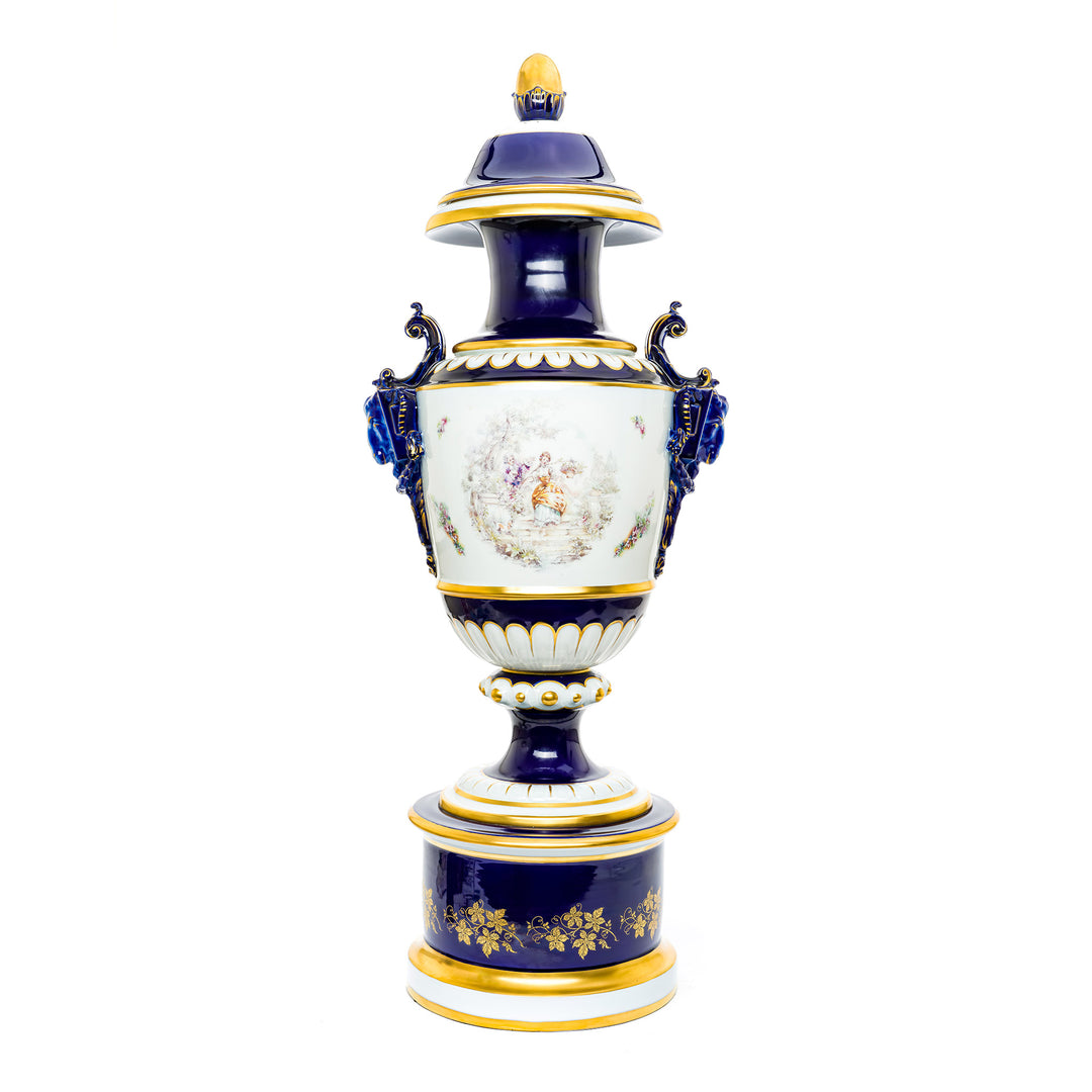 Hand-painted cobalt blue and white porcelain vase with classical scenes.