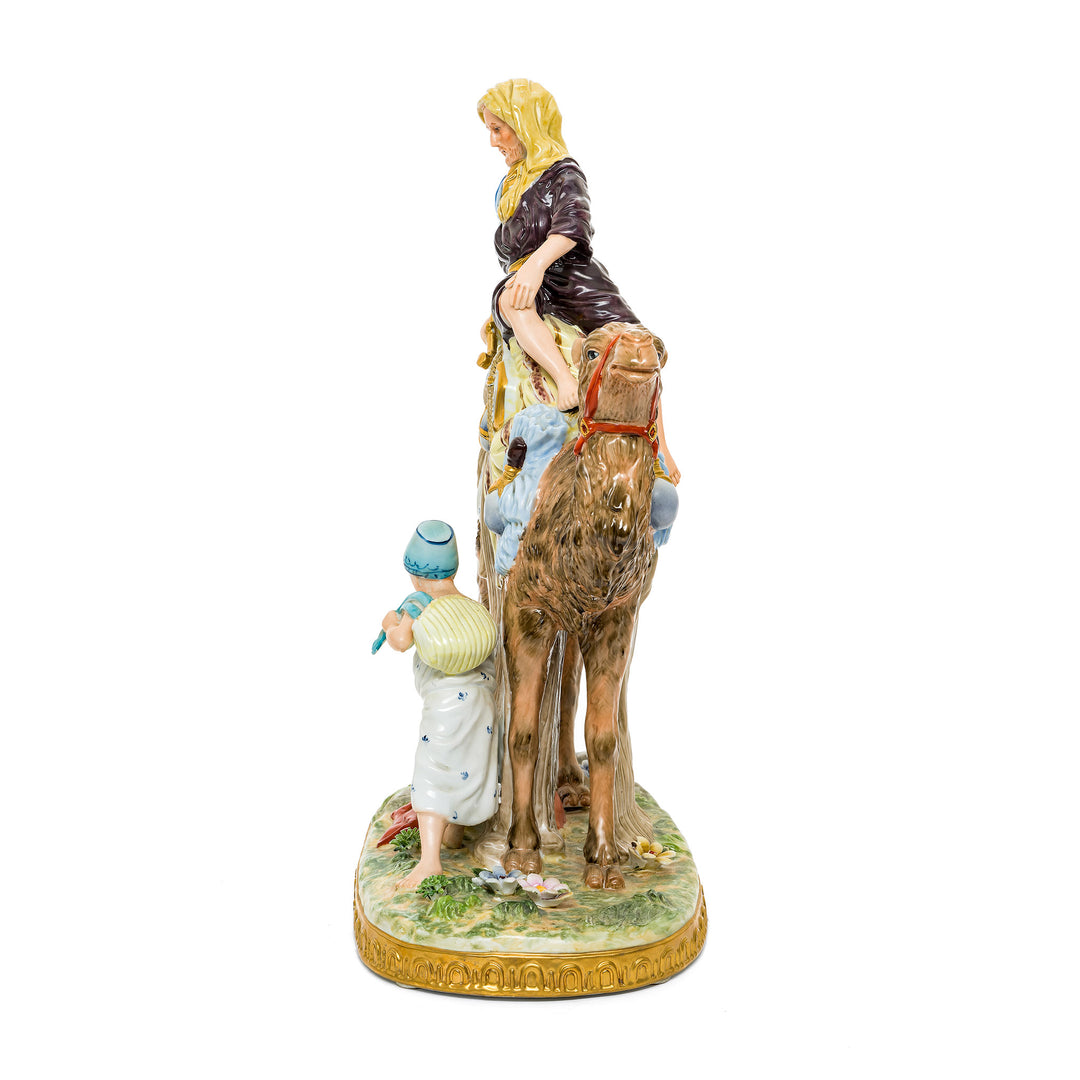 Hand-painted desert journey figurine with a camel and traveler, crafted from fine German porcelain.