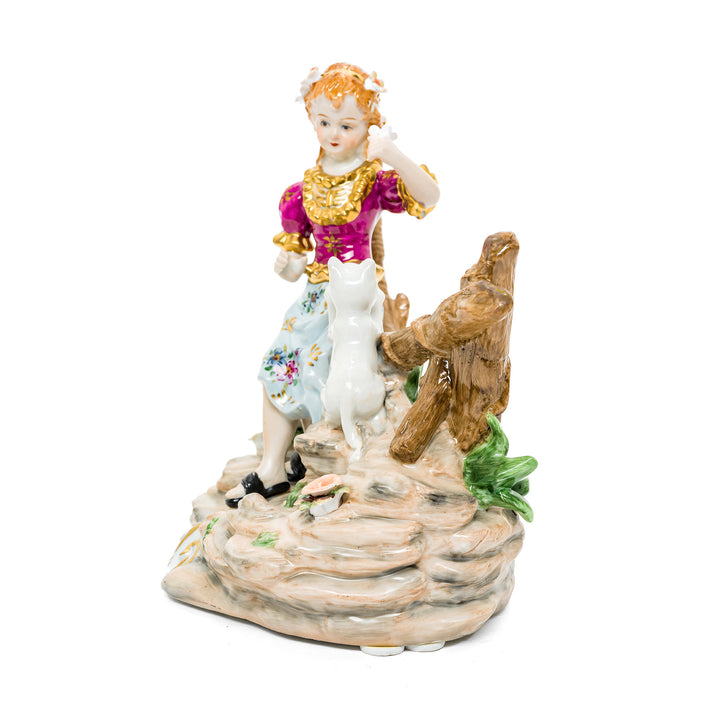 Hand-painted porcelain figurine of a young girl with her kitten, crafted in fine German porcelain.