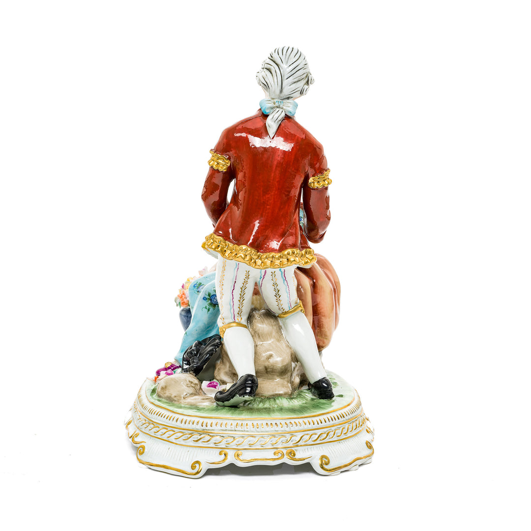 Hand-painted porcelain figurine of a romantic couple with flowers, crafted in fine German porcelain.