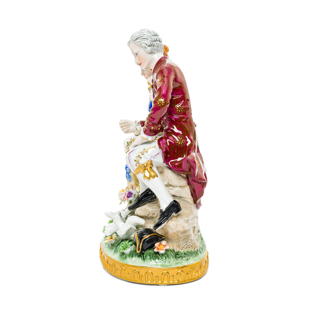 Hand-painted porcelain figurine of a courting couple in springtime, crafted in fine German porcelain.