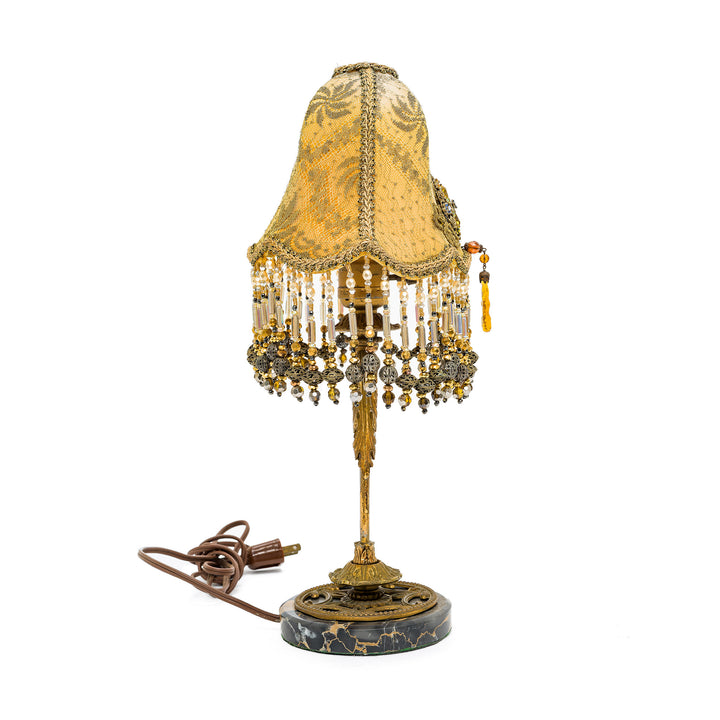 Handcrafted bronze lamp with intricate lace detailing