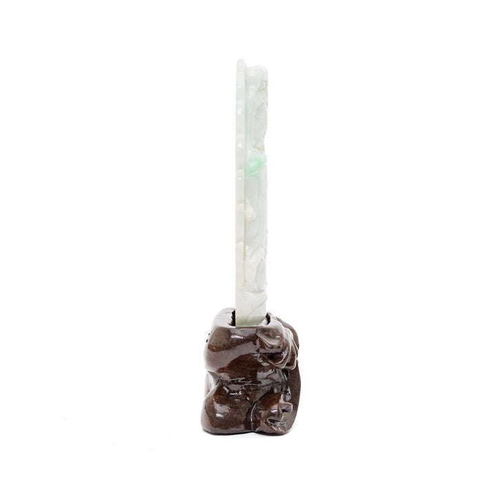Jade Bodhisattva carving with green accents