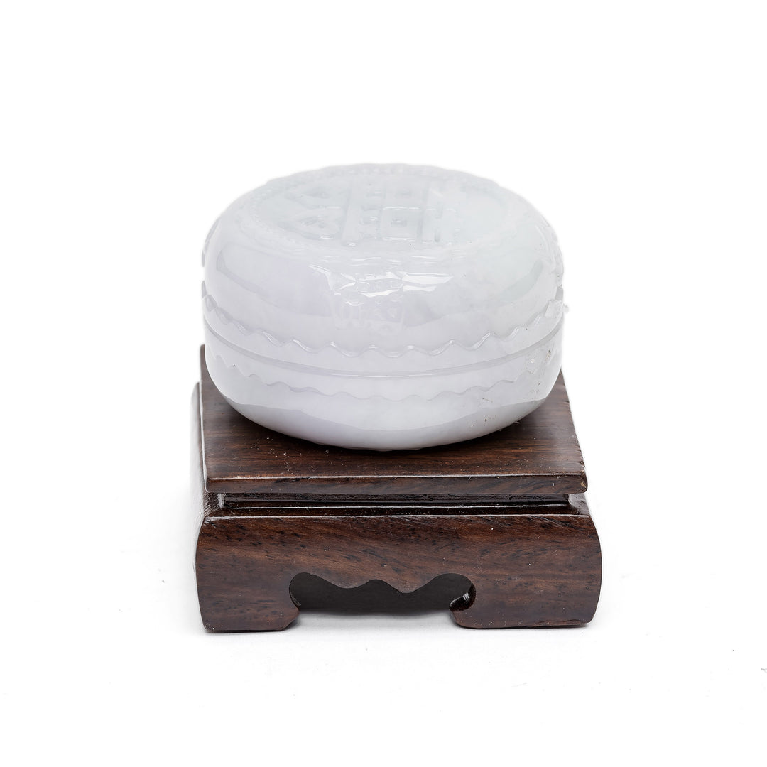 Jade container with spiritual design and base