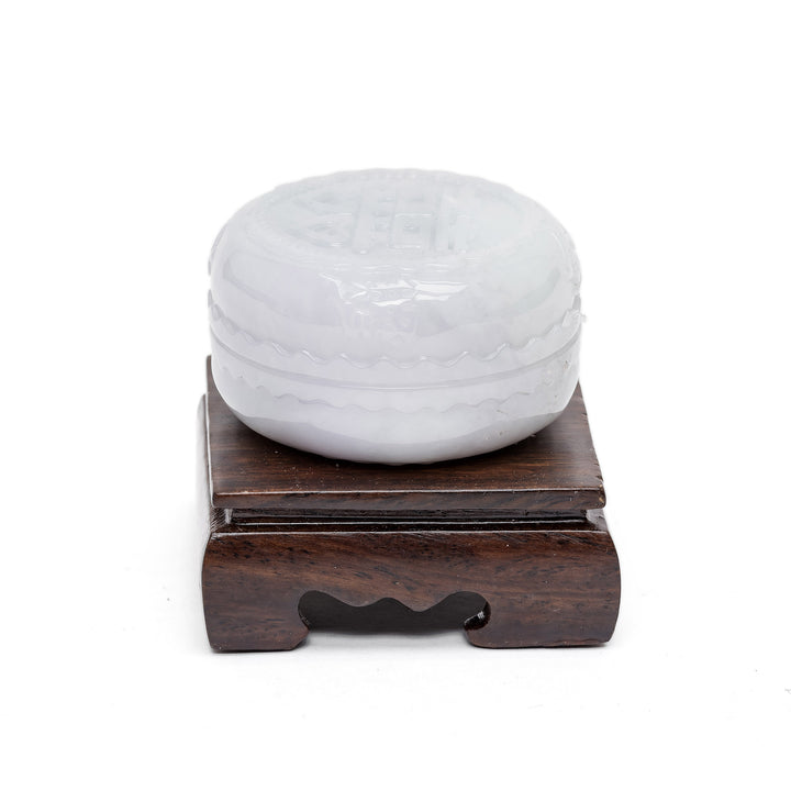 Jade container with spiritual design and base