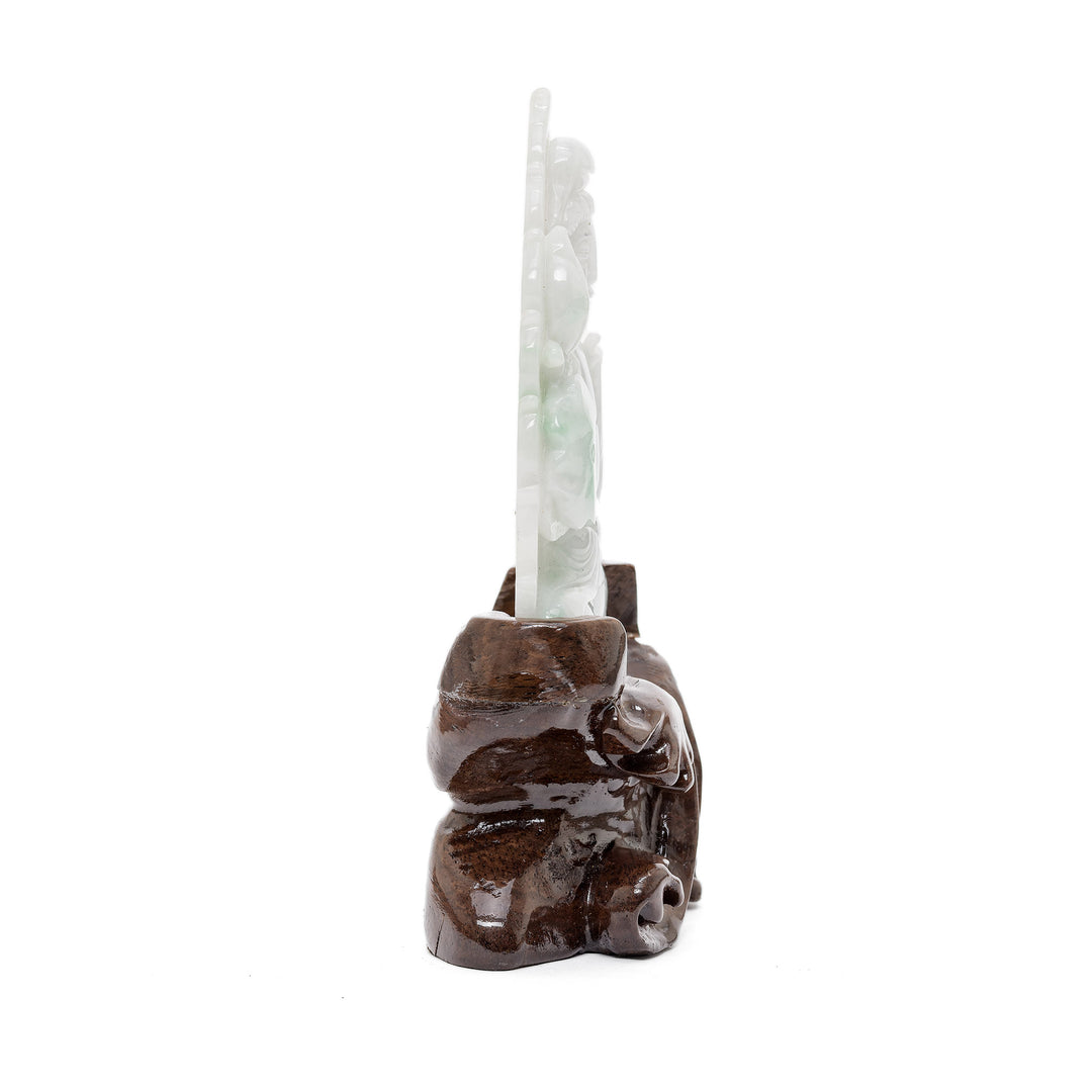 Hand-carved jade goddess figure with floral element