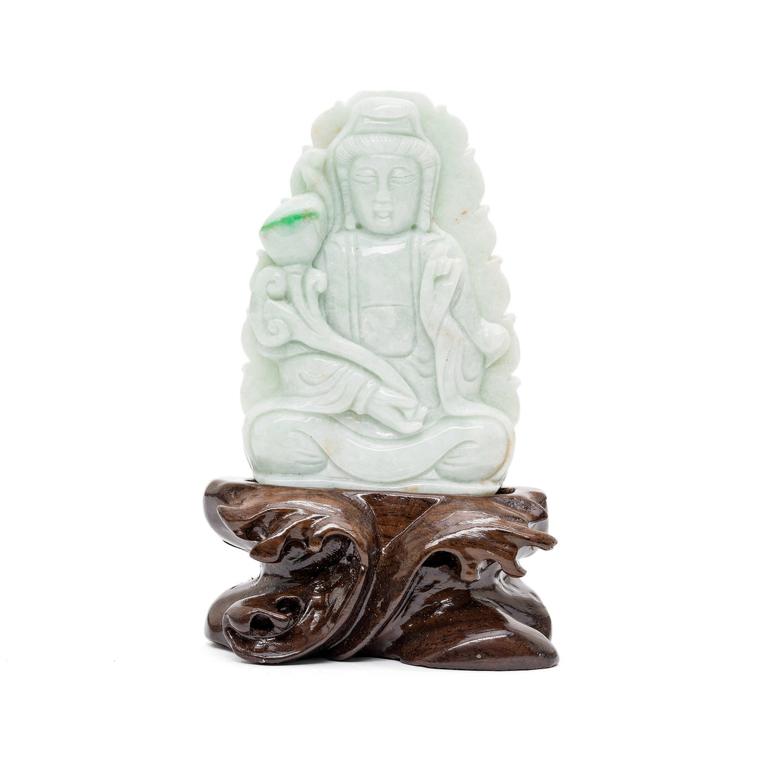 Jade Guan Yin sculpture seated on wooden base