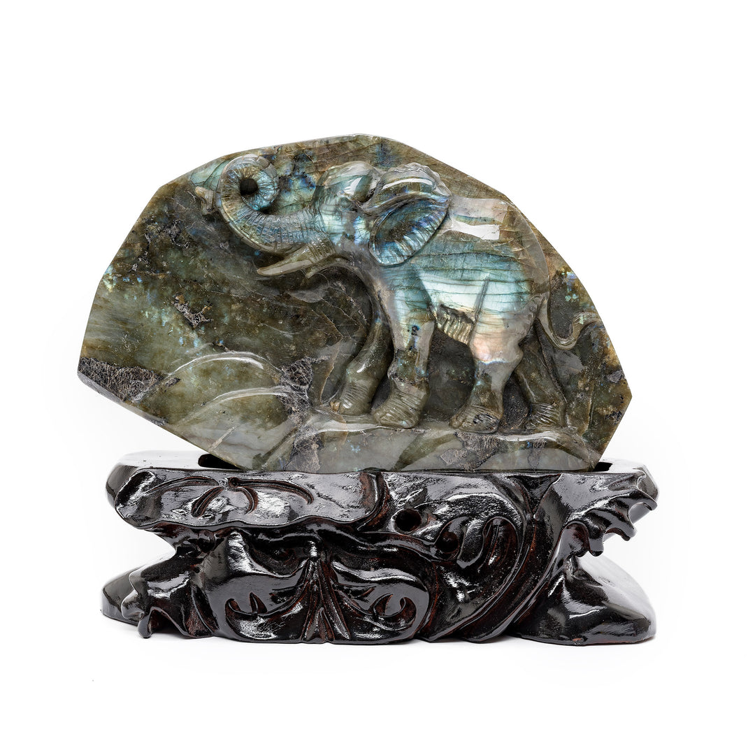 Labradorite elephant carving on black display base