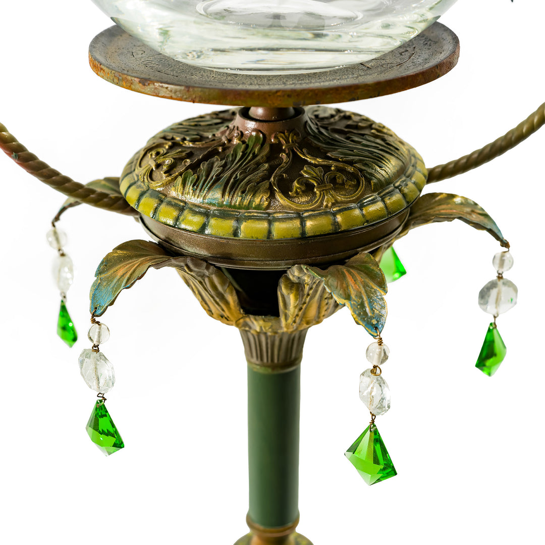 Luxurious embroidered bronze lamp with green crystal details