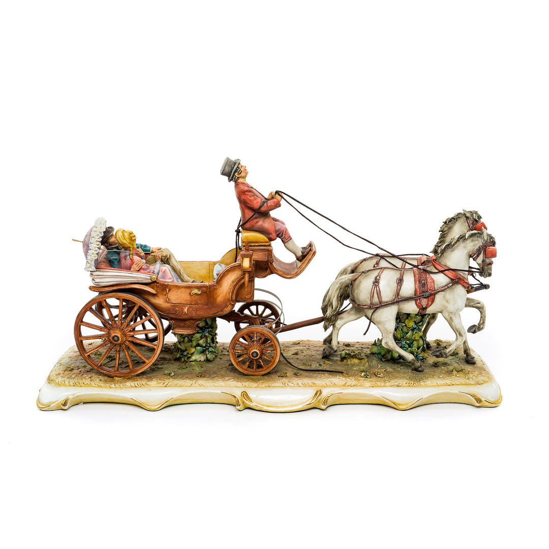 Luxury Capodimonte porcelain horse carriage sculpture with golden wheels.