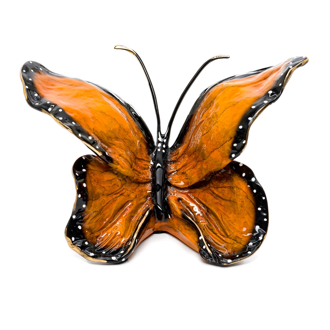 Bronze monarch butterfly sculpture with black and orange wings