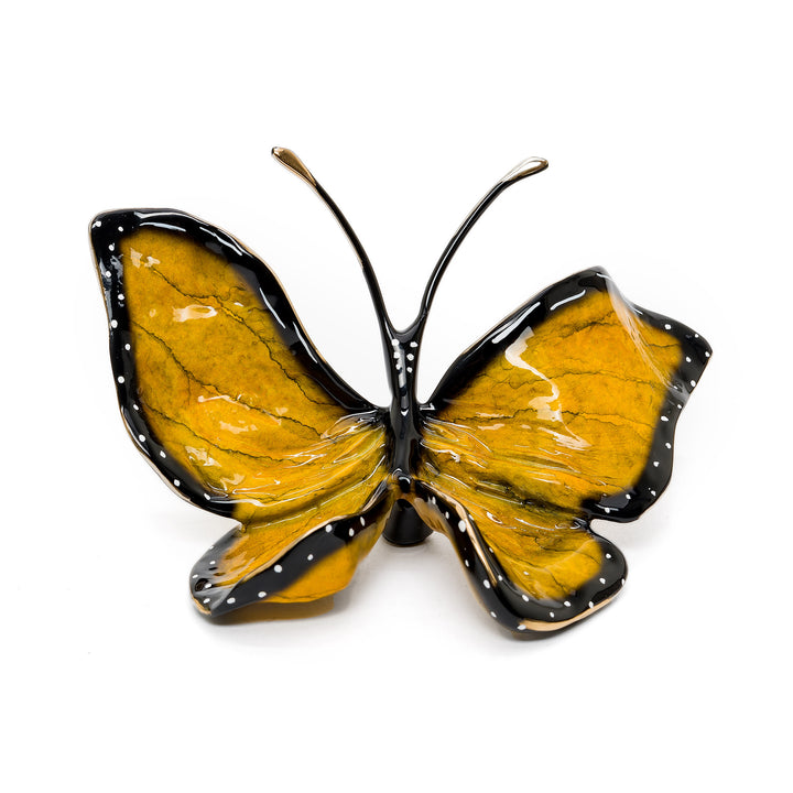 Monarch-inspired bronze butterfly sculpture with amber and black wings