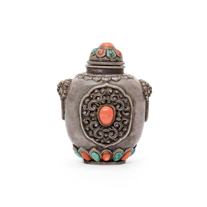 Front view of Mongolian silver snuff bottle with coral and turquoise accents