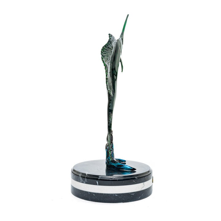 Ocean-themed sailfish statue with vibrant green and blue patina on marble base.