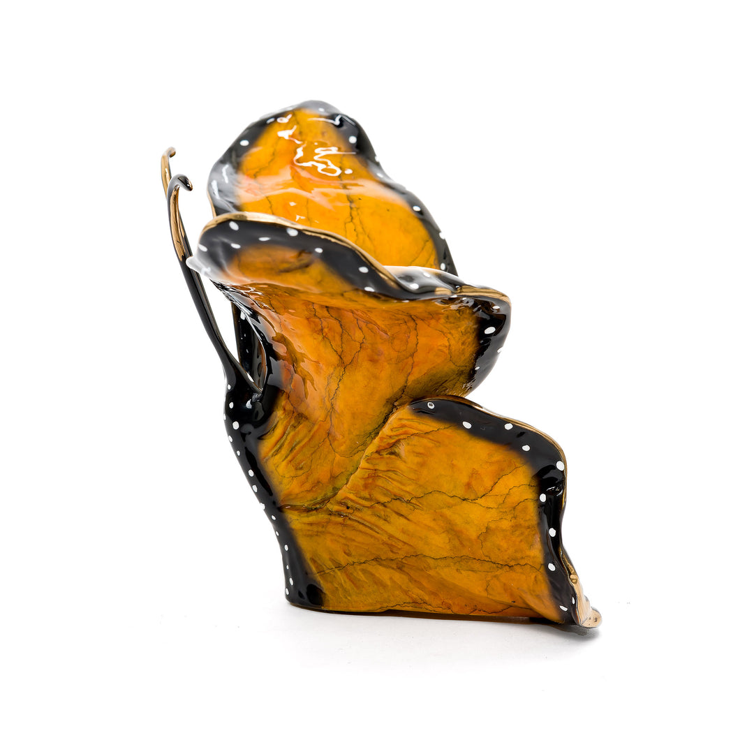 Detailed wing texture on orange and black butterfly figurine