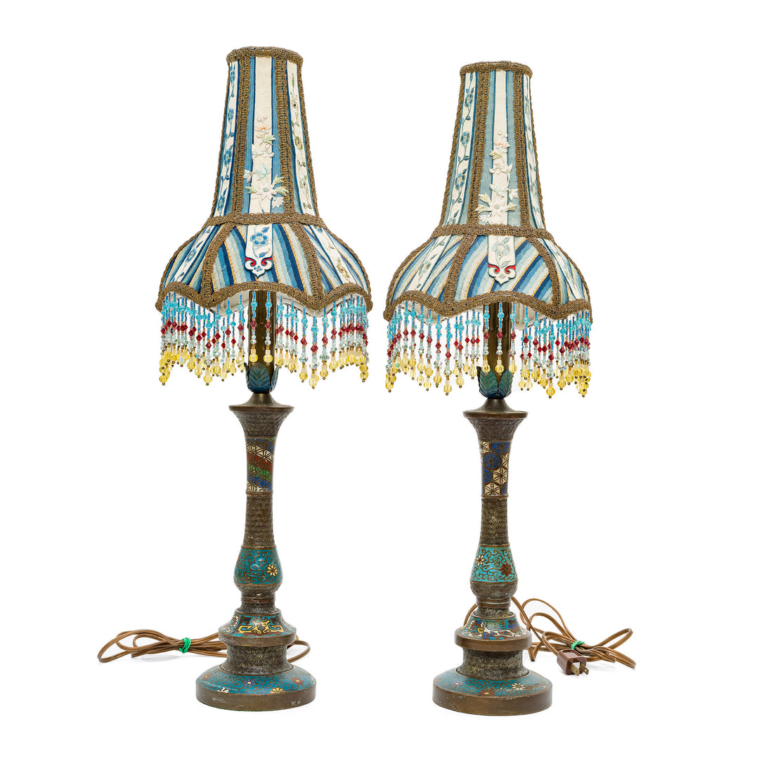 Pair of embroidered bronze lamps with antique materials