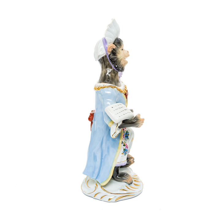 Playful German porcelain figurine of a monkey maestro leading an orchestra with elegant hand-painted details.