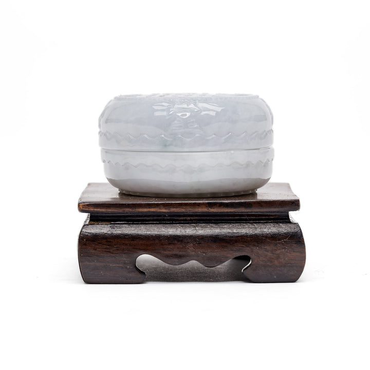 Polished jade trinket container with symbol