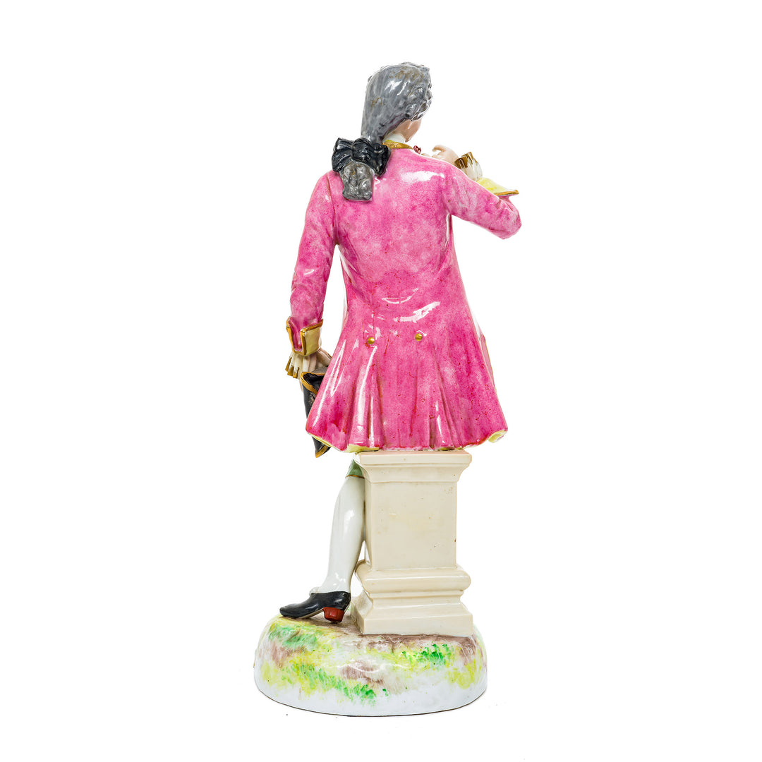 Rococo gentleman with a rose, dressed in vibrant floral attire, crafted from fine German porcelain.