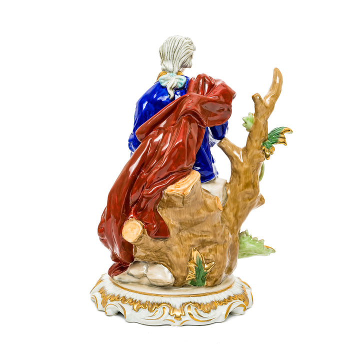 Romantic German porcelain figurine of a nobleman playing a lute, dressed in 18th-century attire.