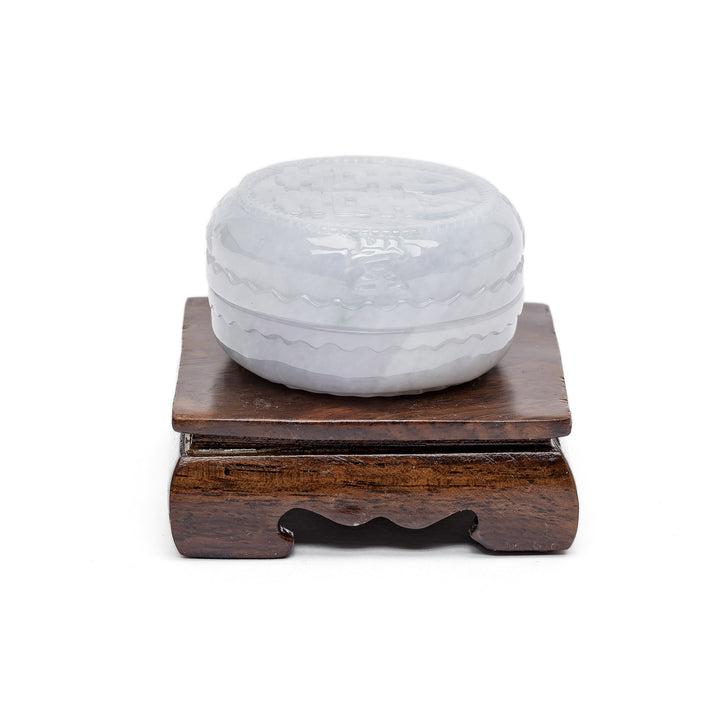 Round jade keepsake box on wooden pedestal
