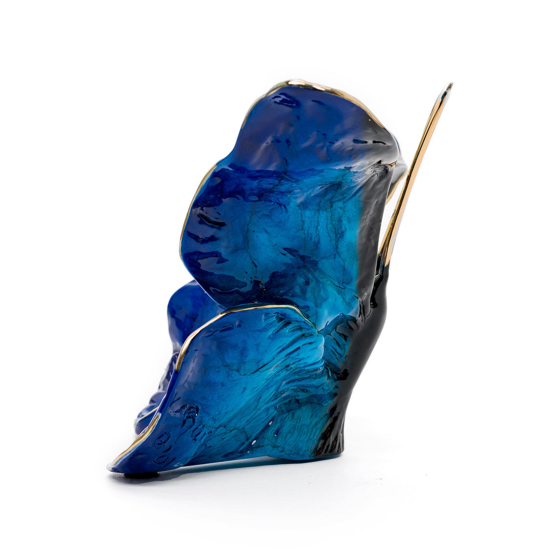 Side view of Ruiz butterfly sculpture in sapphire enamel