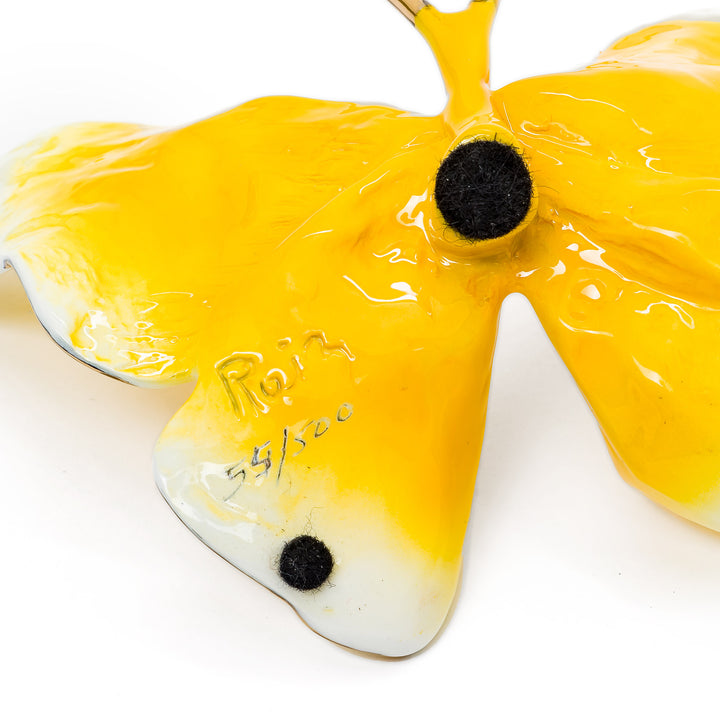 Signature and edition number beneath bronze butterfly wing