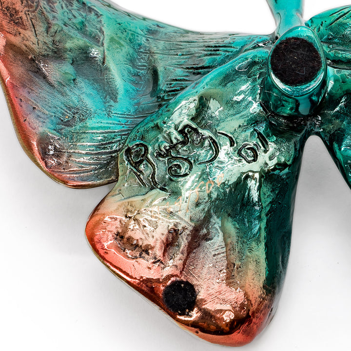 Back of butterfly showing artist signature and patina detail