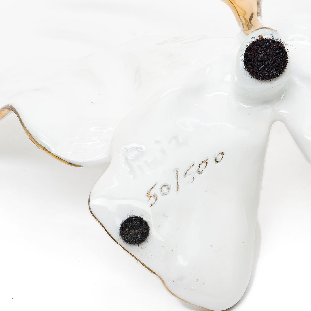 Signature and edition number engraved beneath butterfly wing
