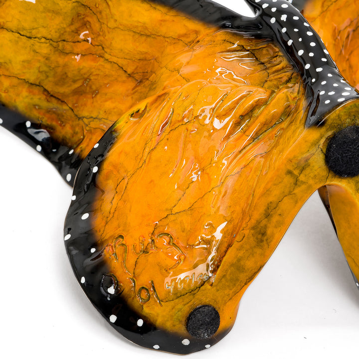Underside with artist signature and edition number