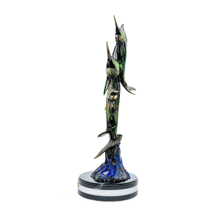 Side view of a bronze triple sailfish statue with Lamborghini-inspired paint.