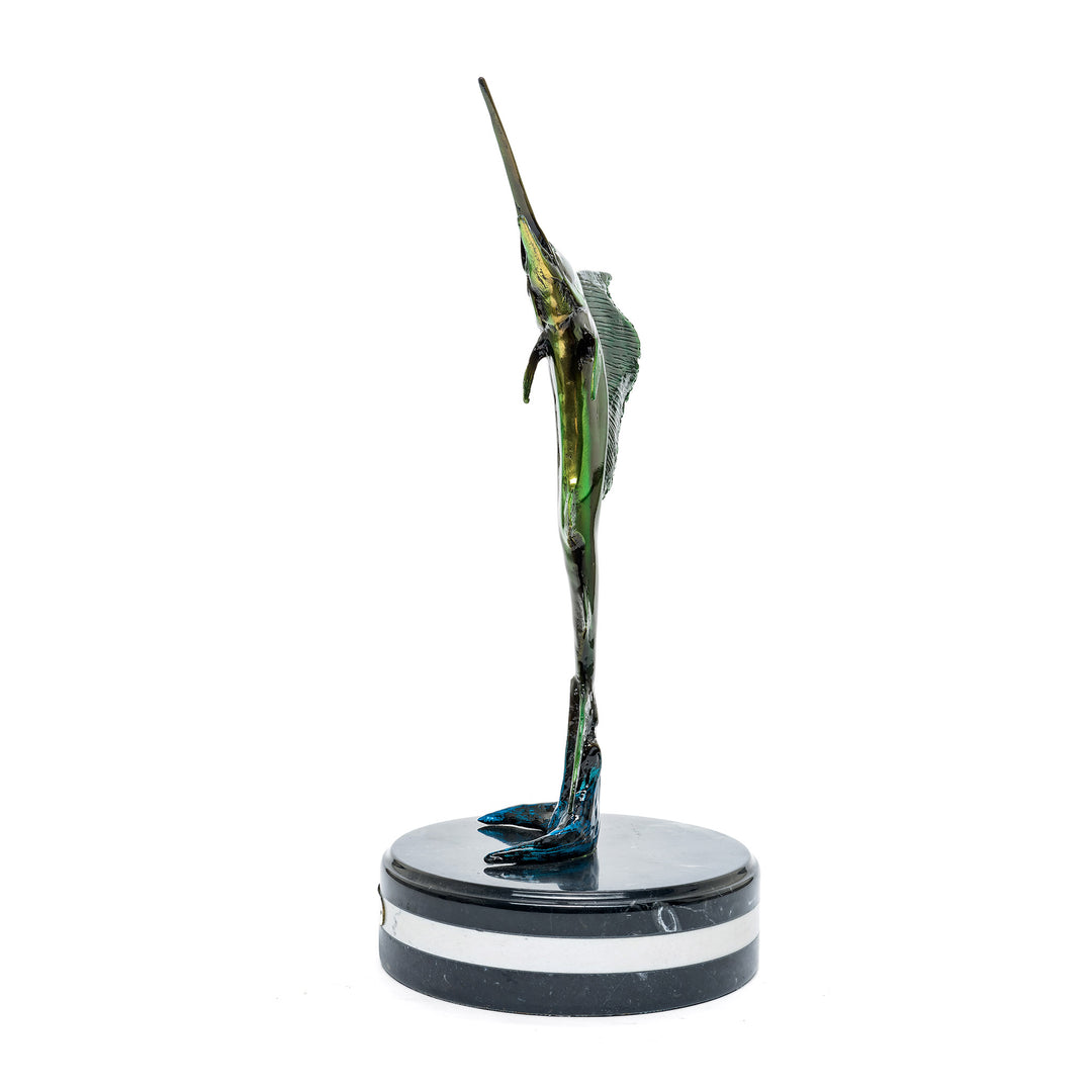 Side view of bronze upright sailfish sculpture with marble base and custom patina.