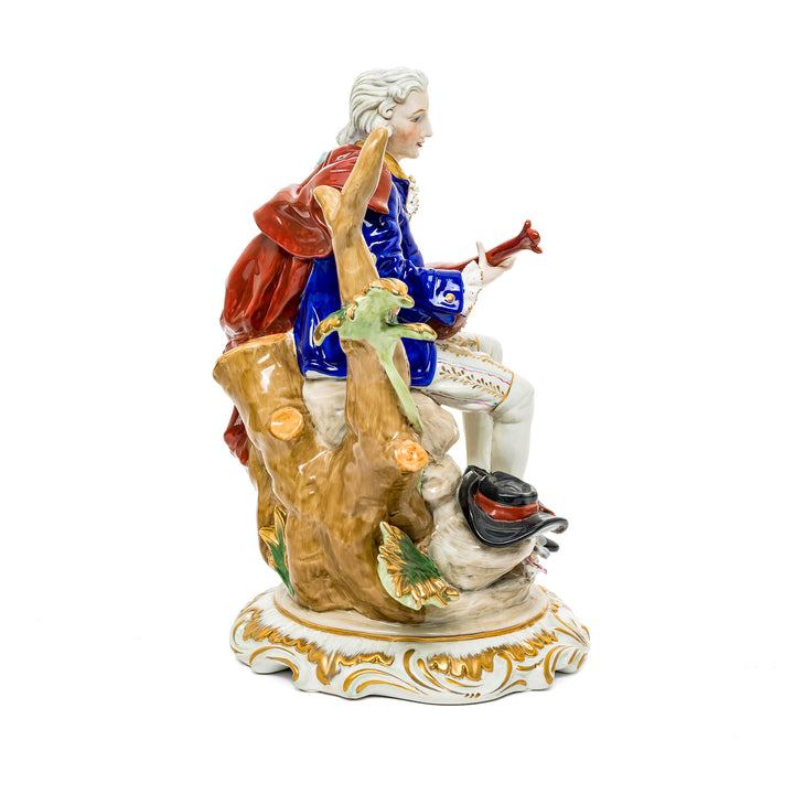 Serenading nobleman German porcelain figurine, crafted with vibrant colors and detailed hand-painted features.