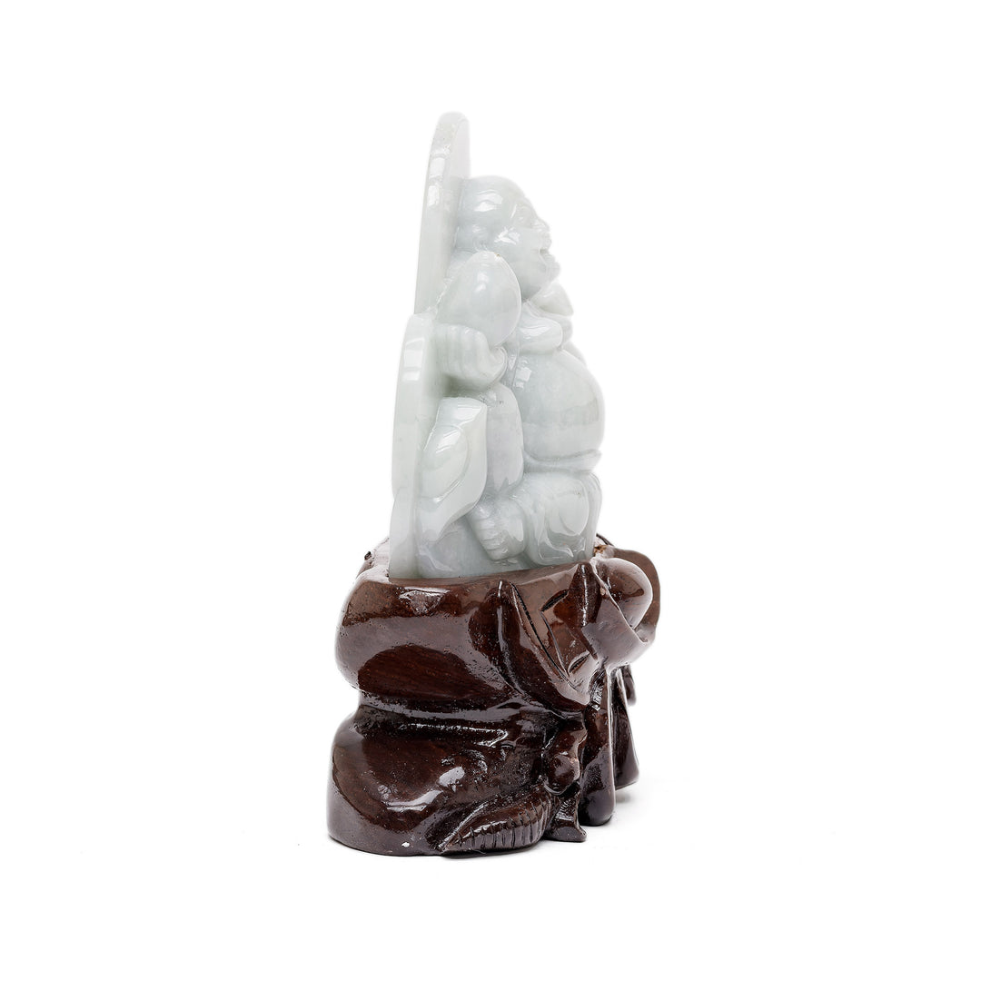 Side profile of jade Buddha holding scepter