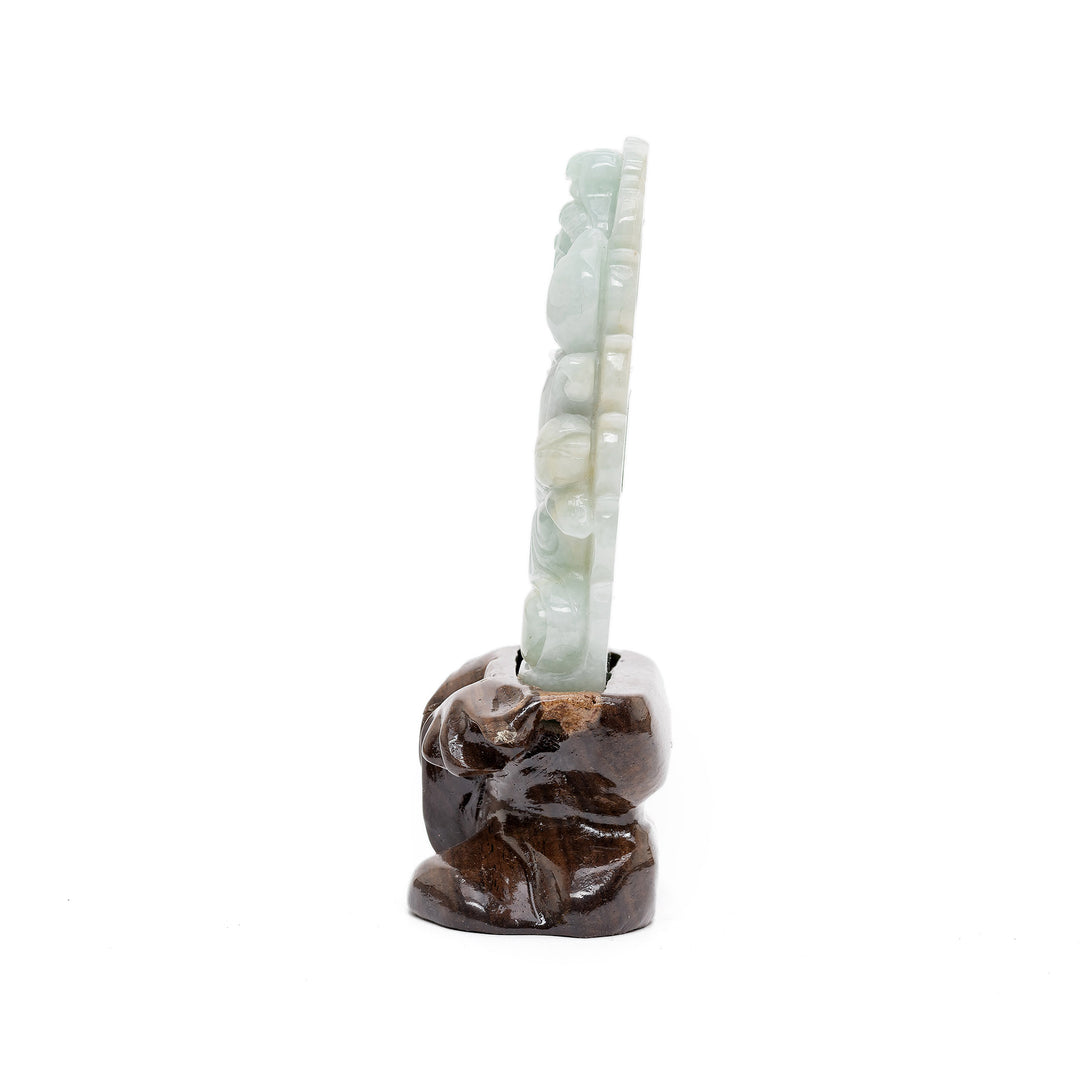 Side view of jade Guan Yin figure holding scepter